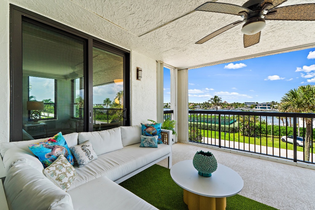 Balcony with white sectional sofa and Intracoastal water views