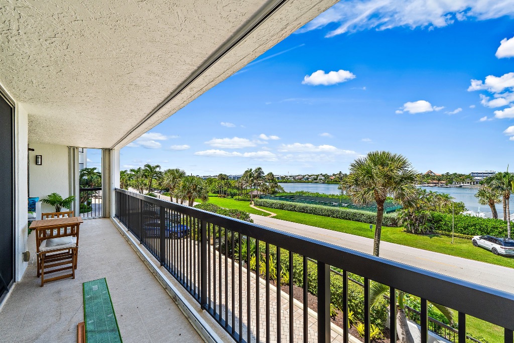Wide balcony with full Intracoastal view, tennis courts and grounds