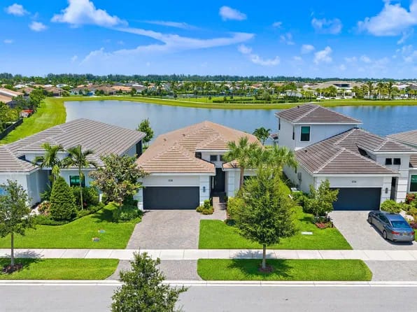 15883 Key Biscayne Lane — aerial view showing lakefront lot and neighborhood