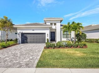 15883 Key Biscayne Lane — front facade with entry tower and two-car garage