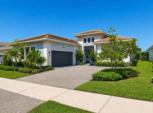 15883 Key Biscayne Lane — paver driveway approach with tropical landscaping