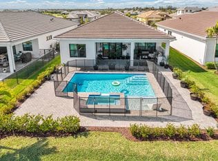 15883 Key Biscayne Lane — aerial view of pool, sun shelf and rear yard