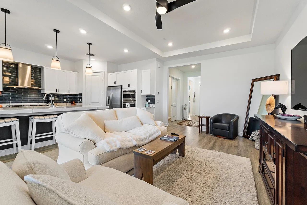 15883 Key Biscayne Lane — open-concept living room with view into kitchen