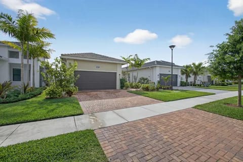 15883 Key Biscayne Lane — street-level view showing home and Westlake community