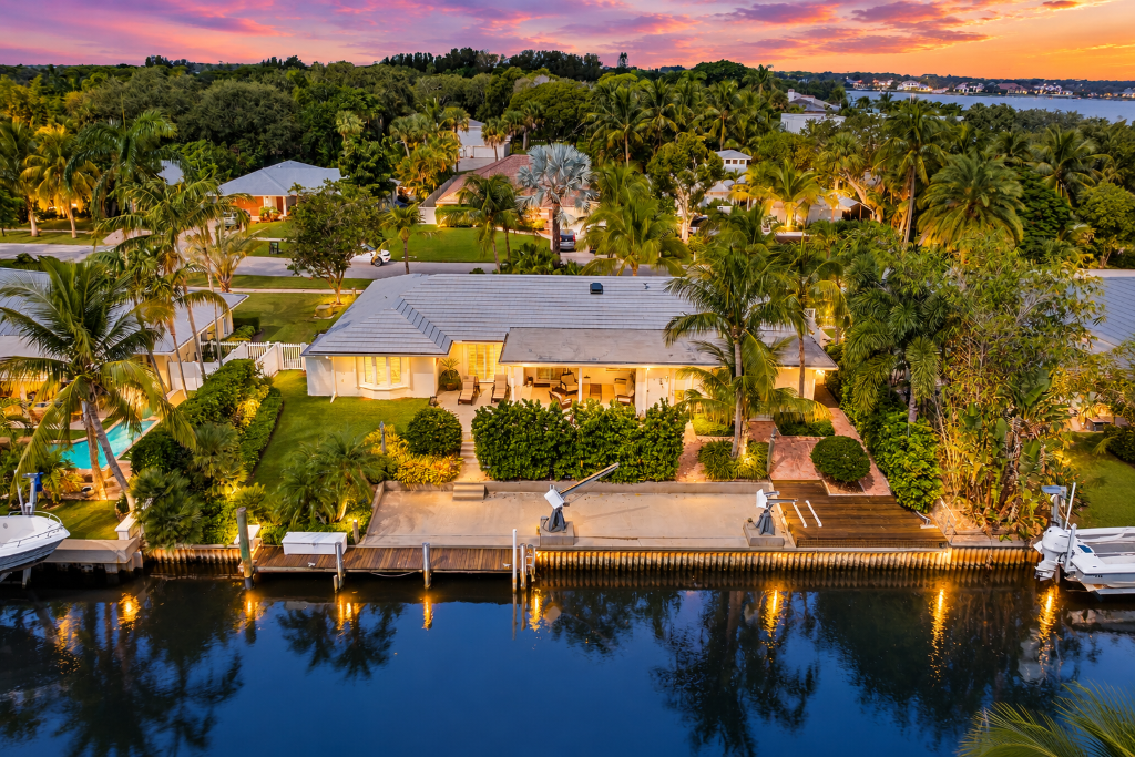 18150 Perigon Way — twilight waterfront aerial with private dock