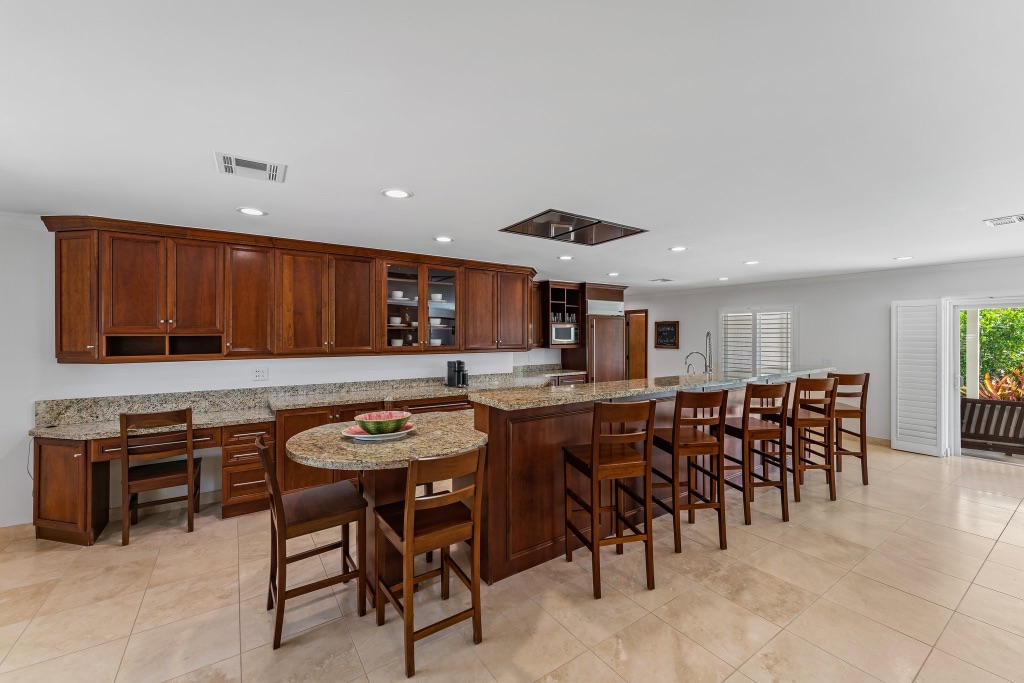 Kitchen — long granite counter run with built-in desk nook