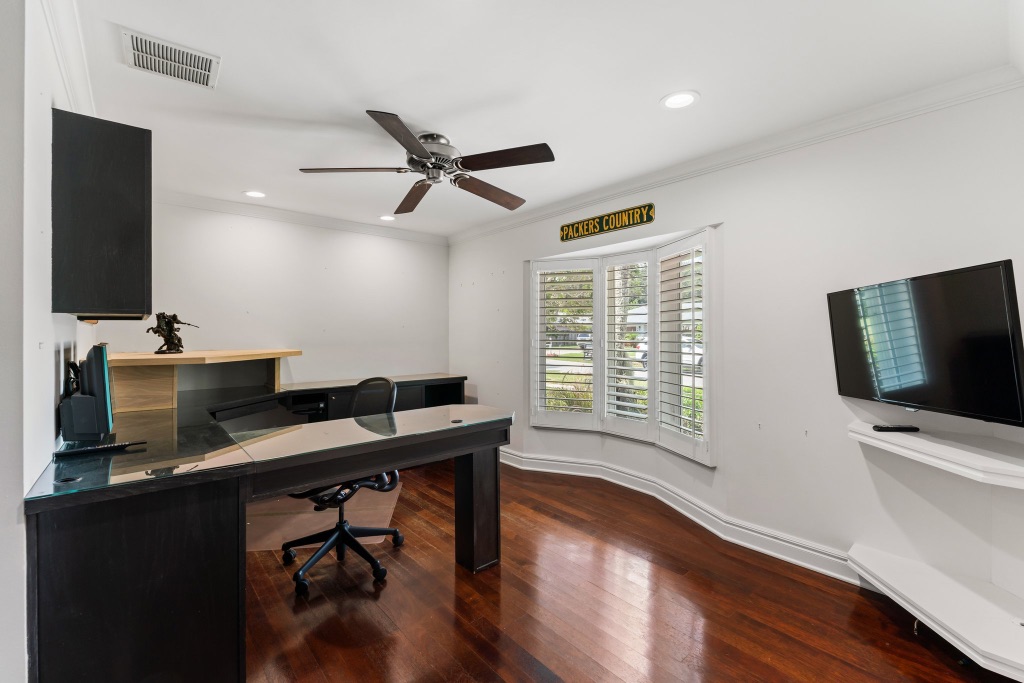 Private home office — built-in desk, bay window, hardwood floors