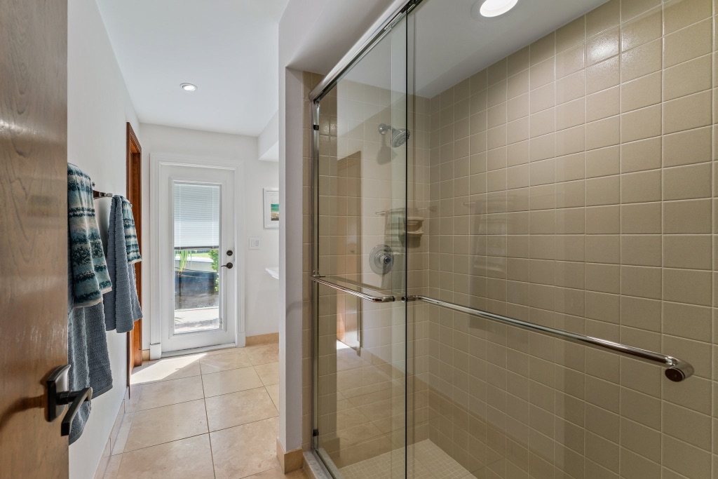 Pool bath — walk-in glass shower with direct outdoor access