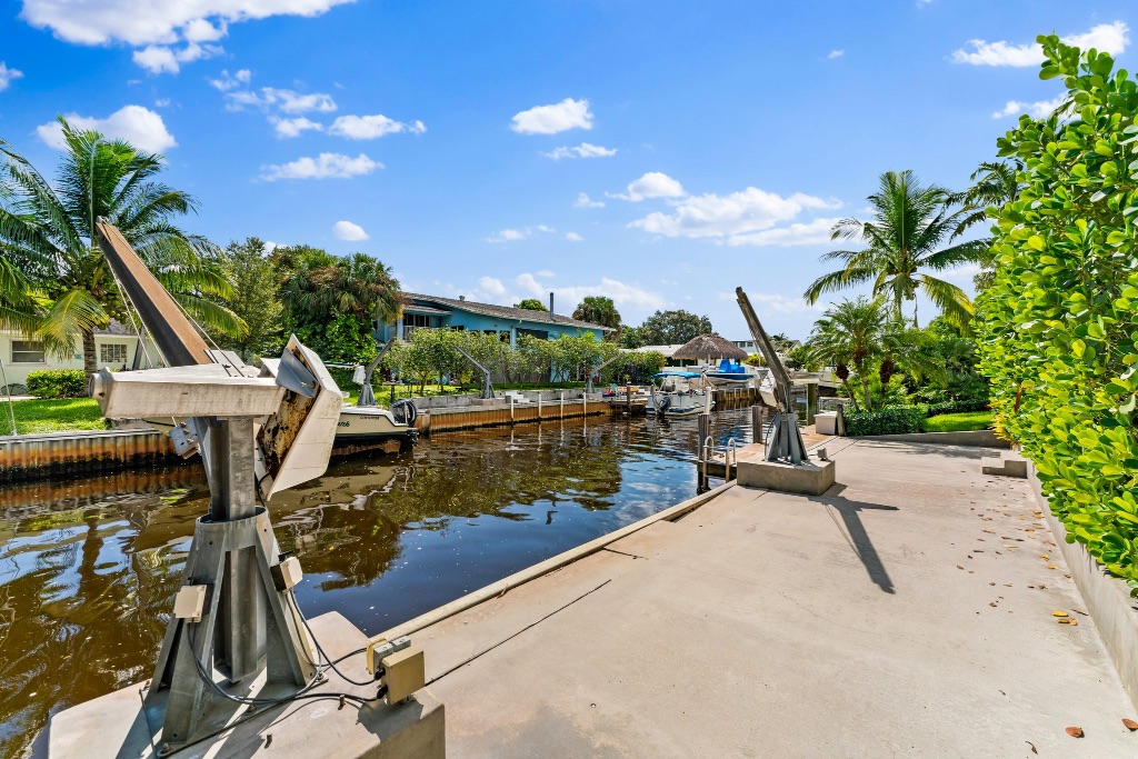 95-ft canal frontage with dual davit cranes and seawall