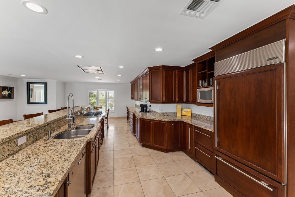 Kitchen — Sub-Zero refrigerator panel and custom cabinetry wall