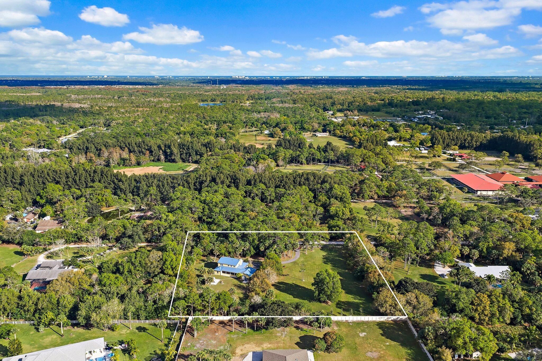 17375 Thunder Road Jupiter FL — aerial view showing 2.5-acre property boundary