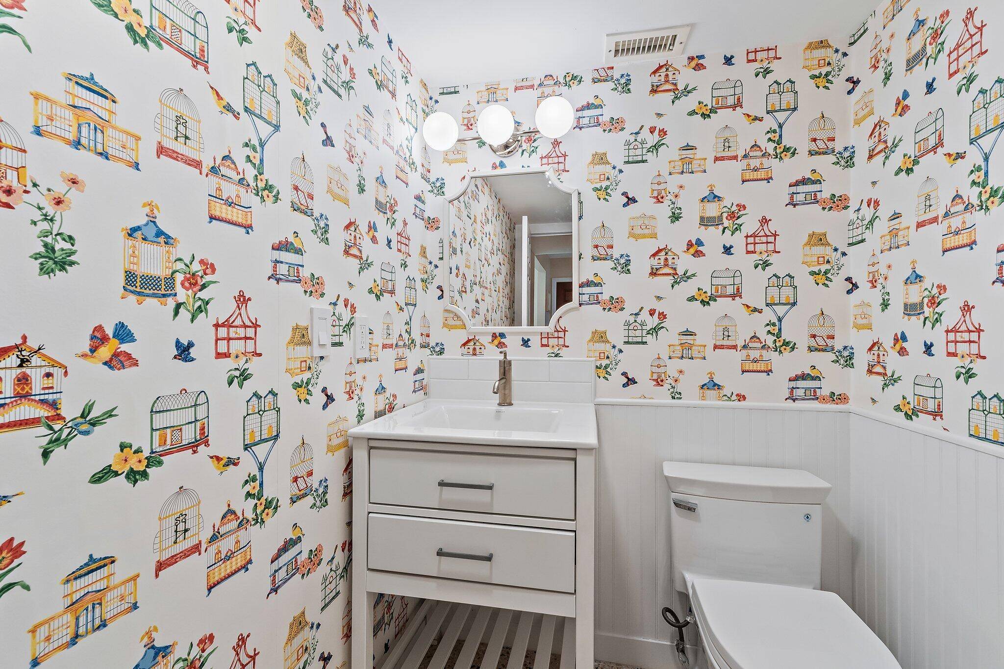 17375 Thunder Road — powder room with birdcage wallpaper and modern fixtures