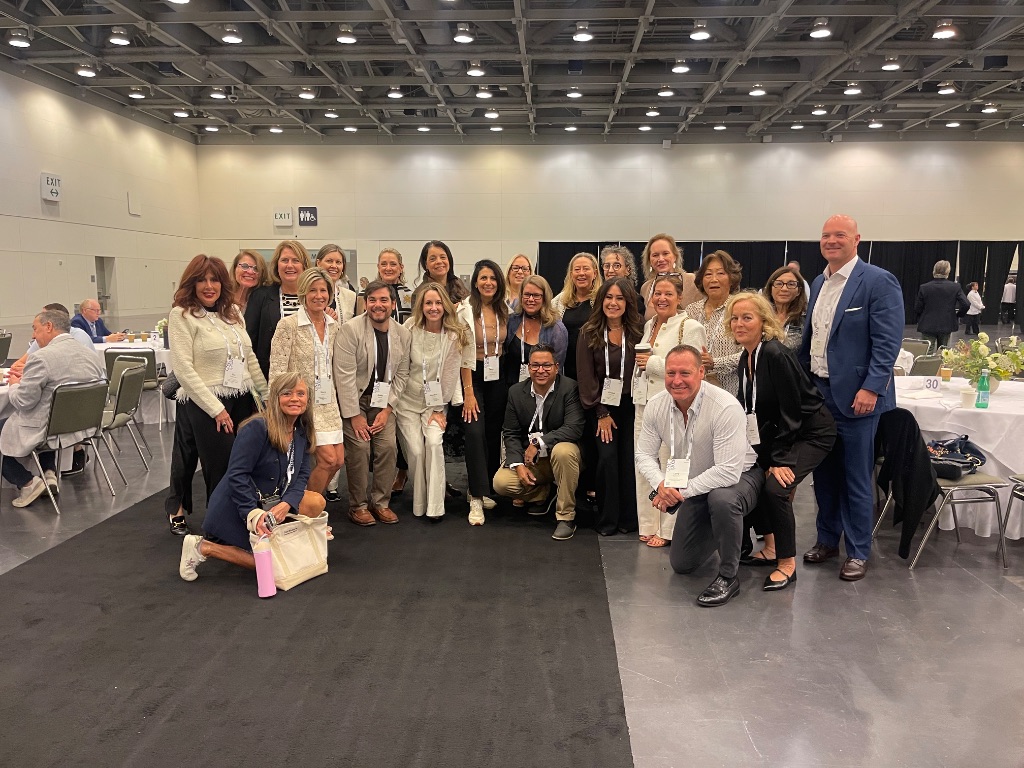 A large group of ONE Sotheby's International Realty colleagues from Florida gather for a team photo in the convention center at the 2026 Global Networking Event